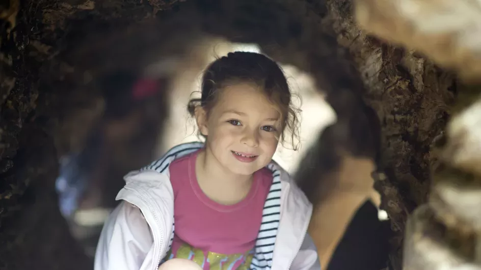 A child in the log trail