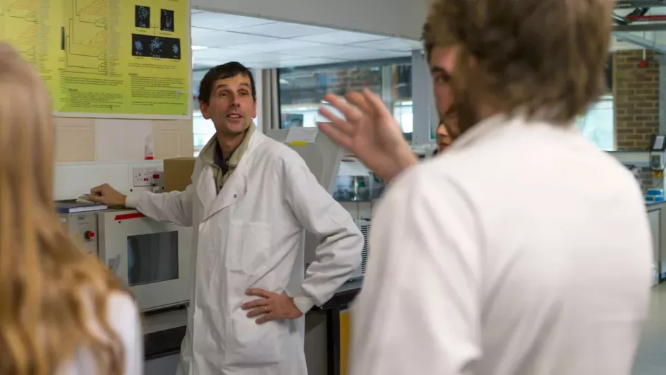 Group of students in a lab on a tour