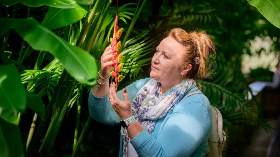 Woman with flower at Kew Gardens 