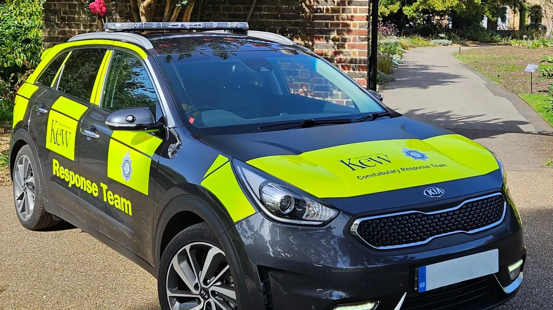 A photo of the Kew Constabulary response vehicle which is a black car with neon yellow stripes