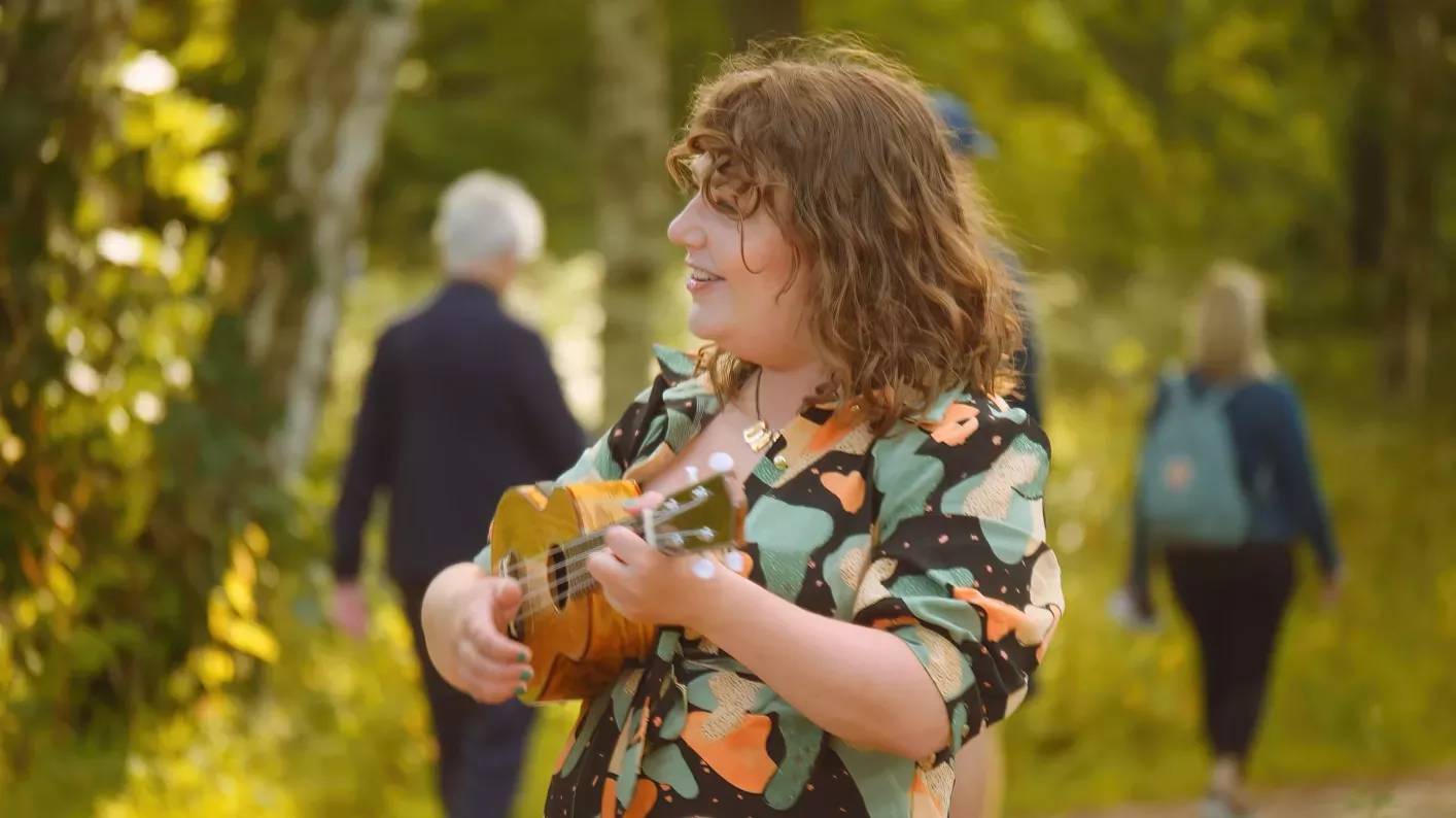 Woman playing a ukulele