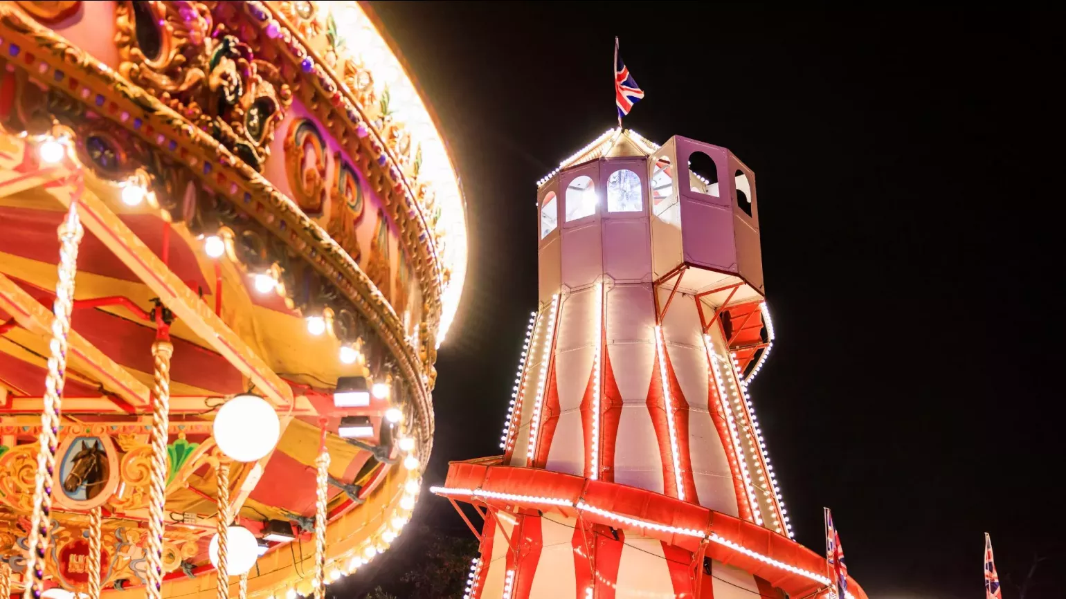 Helter skelter and merry-go-round at night