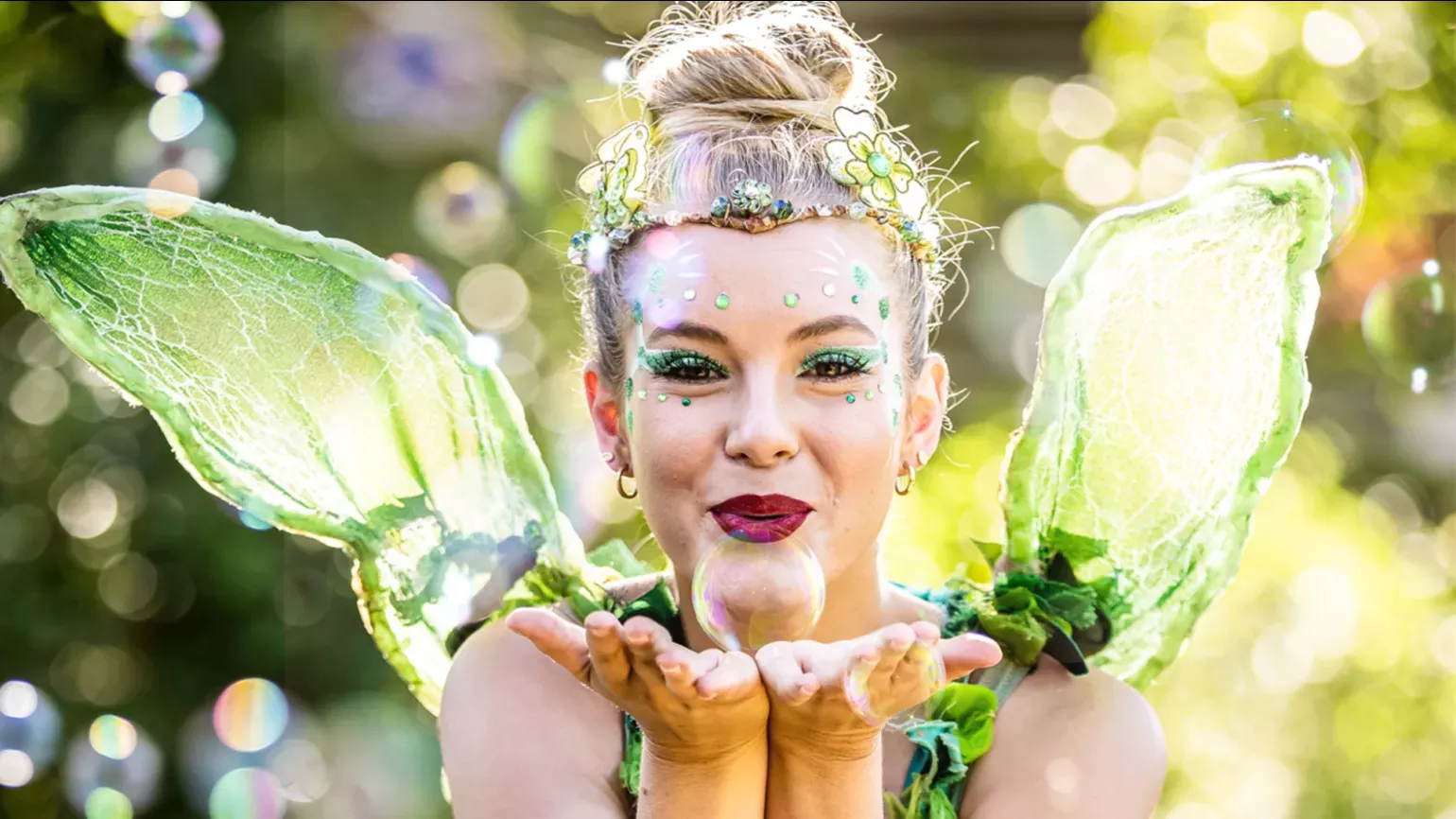 A fairy blowing a bubble