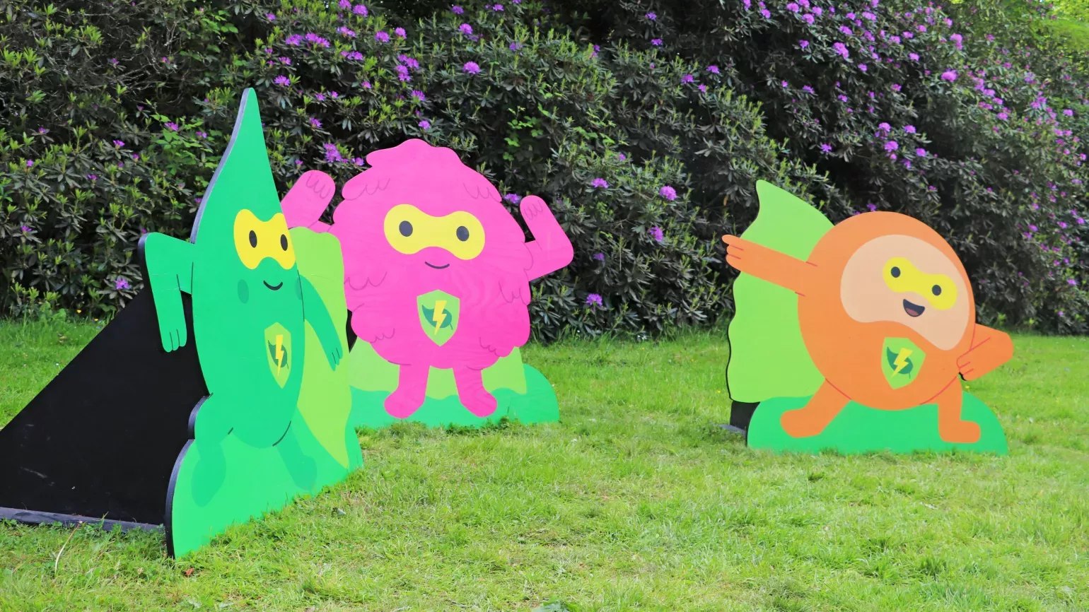 Outdoor brightly coloured wooden displays of cartoon Nature Heroes mascots Pip, Bud and Sprout