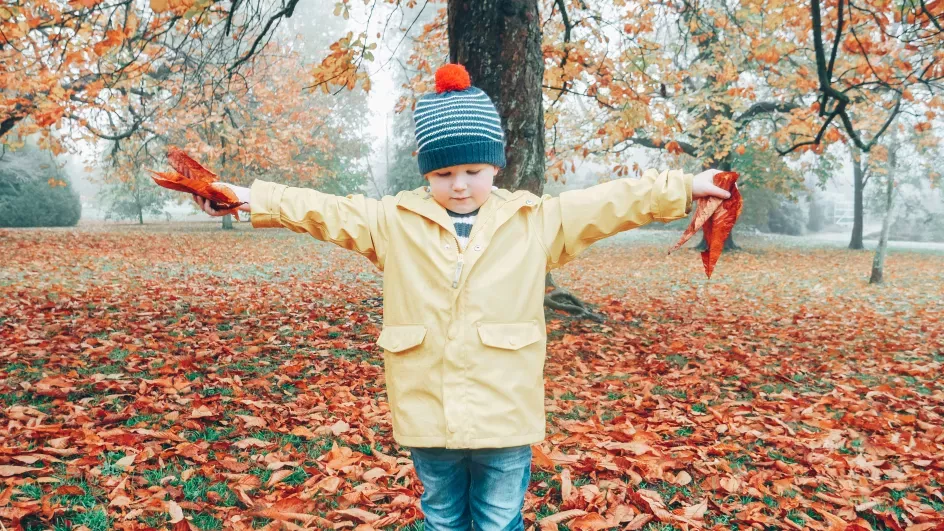 Child playing at Wakehurst in Autumn