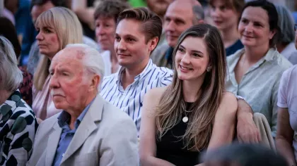 A crowd full of smiling people