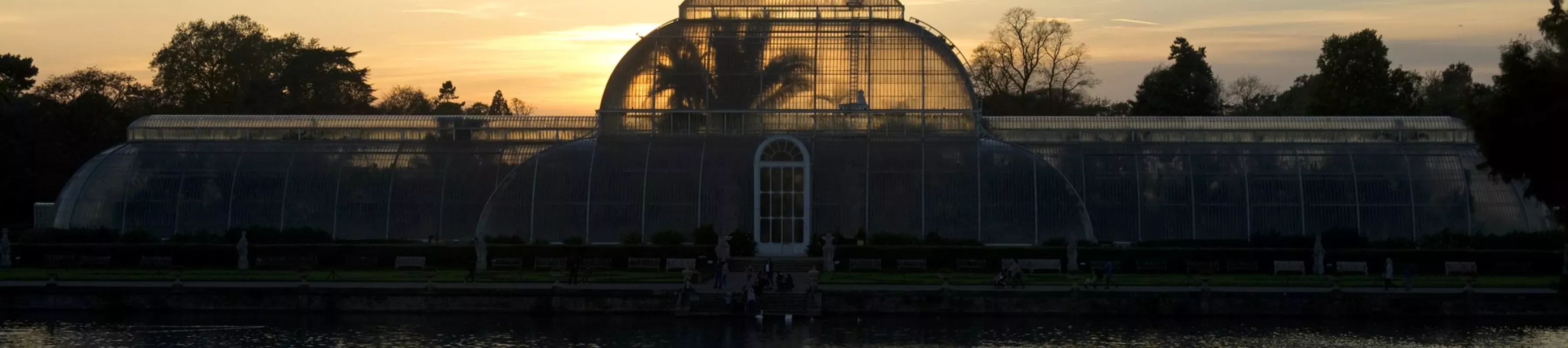 The palm house at kew gardens at sunset