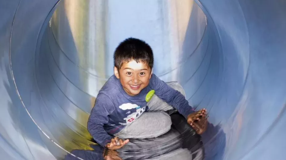 Child having fun in the Children's Garden 