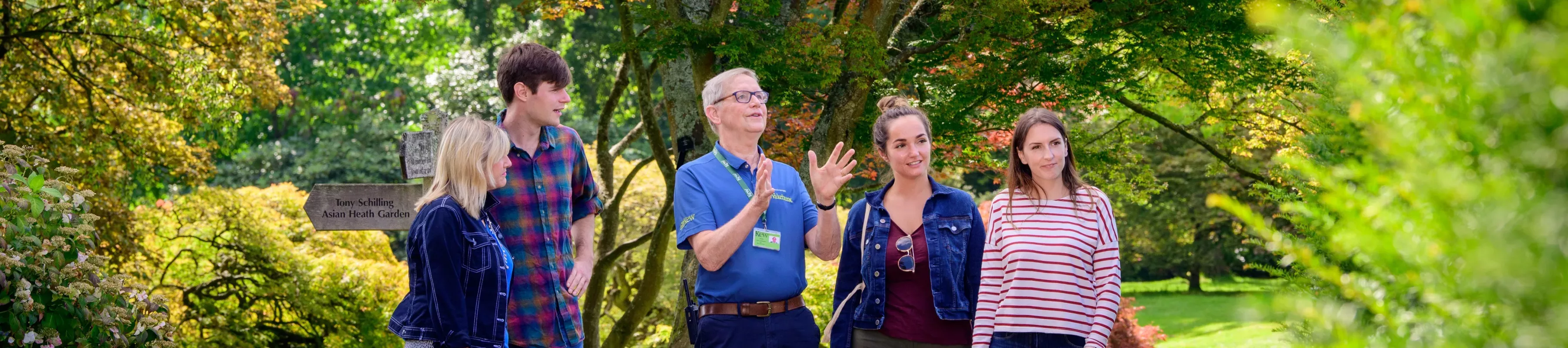 Members of the public enjoying a guided walking tour around Wakehurst