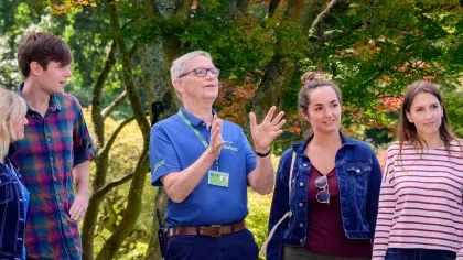 Members of the public enjoying a guided walking tour around Wakehurst