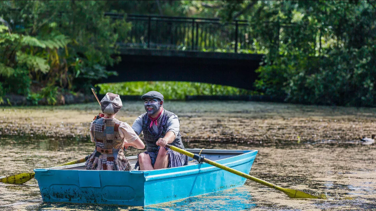 A pair of people in a rowboat